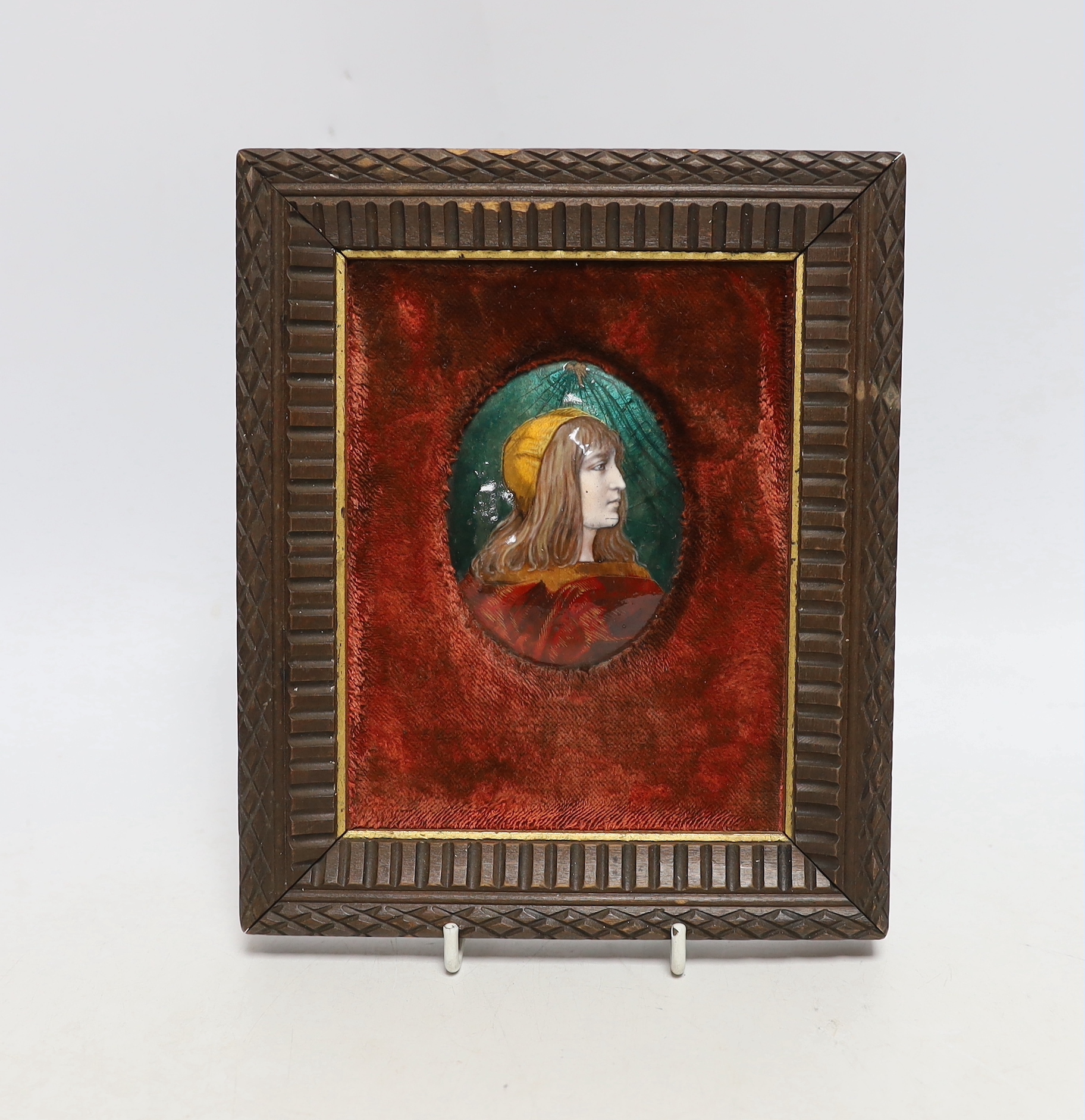 A Limoges oval enamelled plaque of a medieval girl, signed to the reverse, E. Blanchez, framed, overall 21 x 17cm